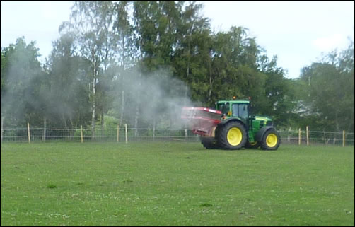 Tractor spreading lime