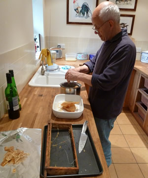 John extracting honey